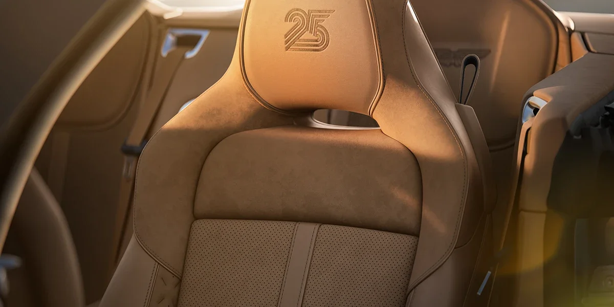 Interior of the Aston Martin Vanquish 25th Anniversary Edition with anniversary embroidery.