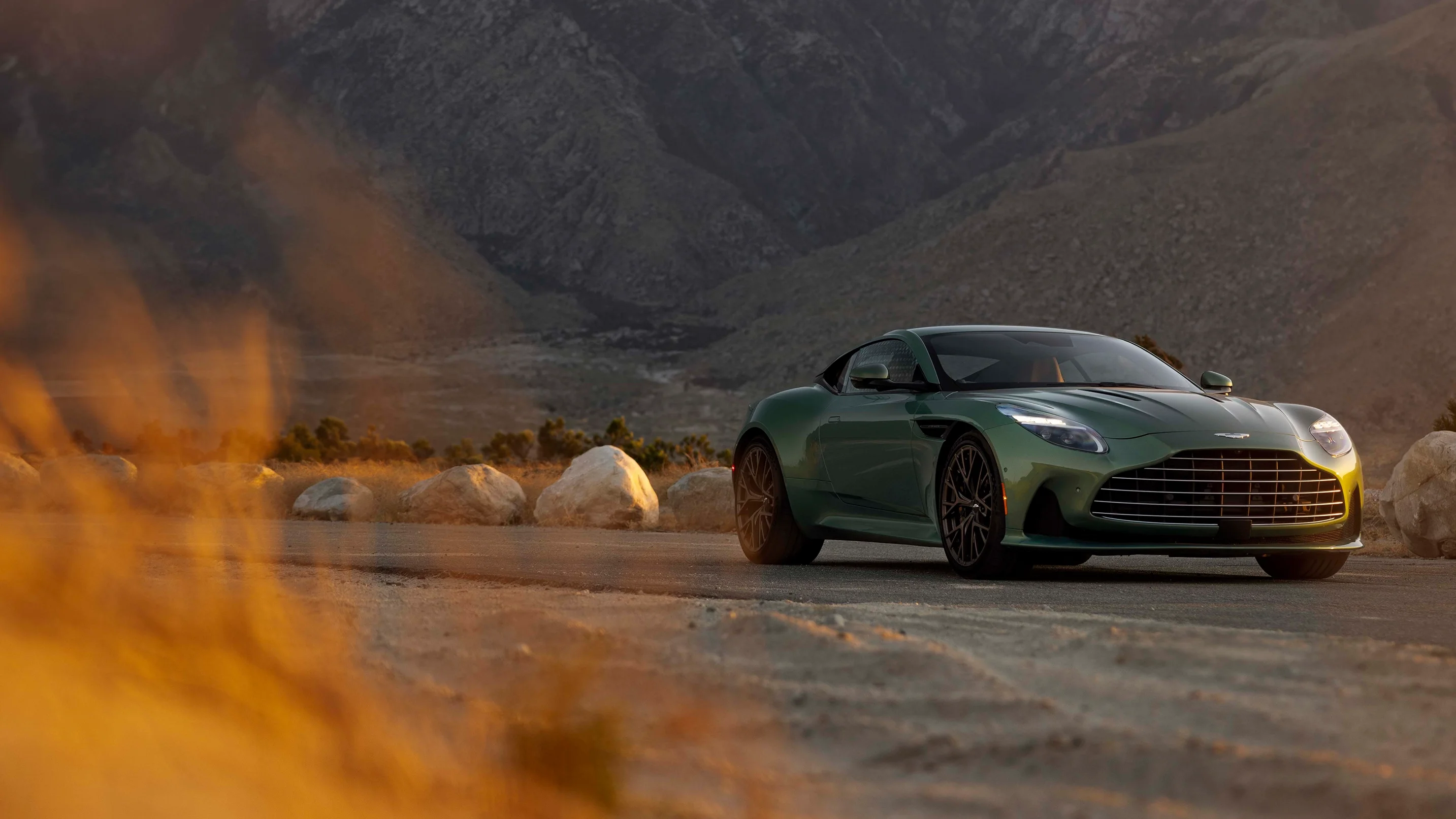 Green Aston Martin DB12 on a desert road near Rancho Mirage, California