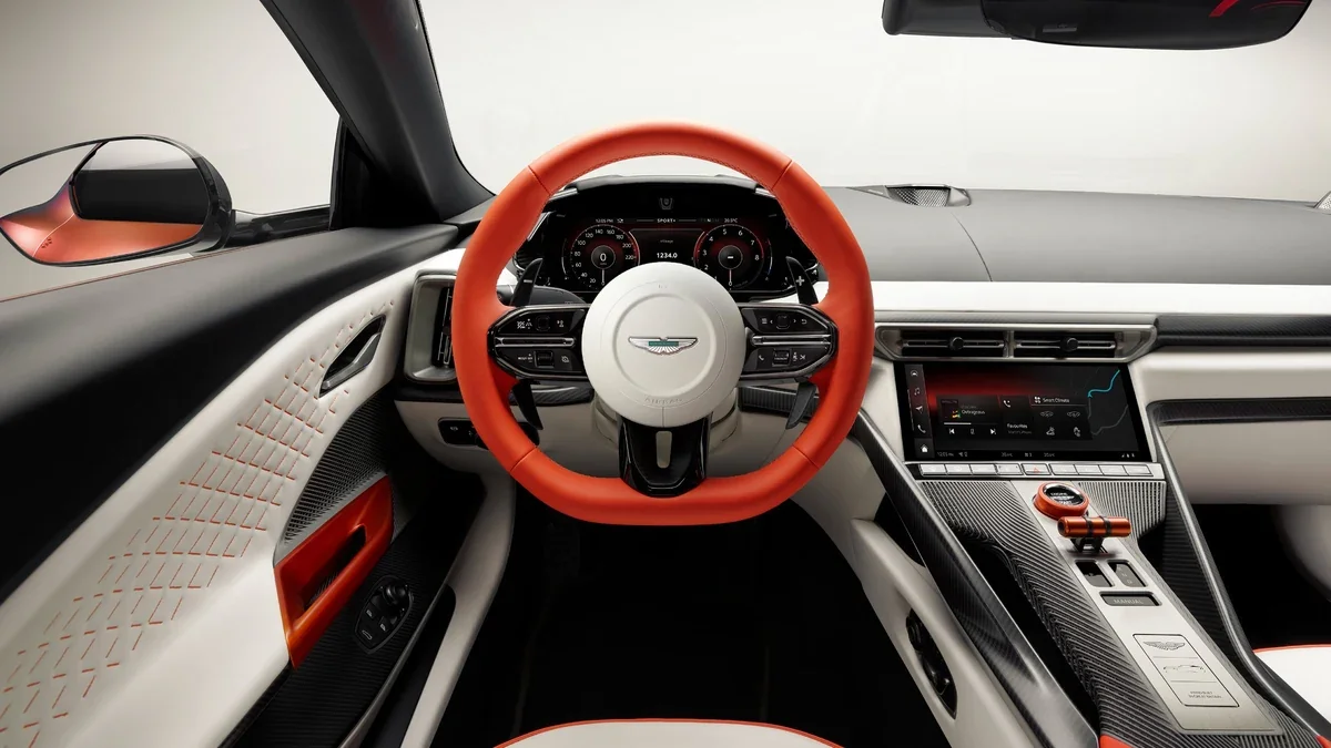 Aston Martin Valen cockpit with driver-focused center console, digital displays, performance controls, and contrasting leather trim.