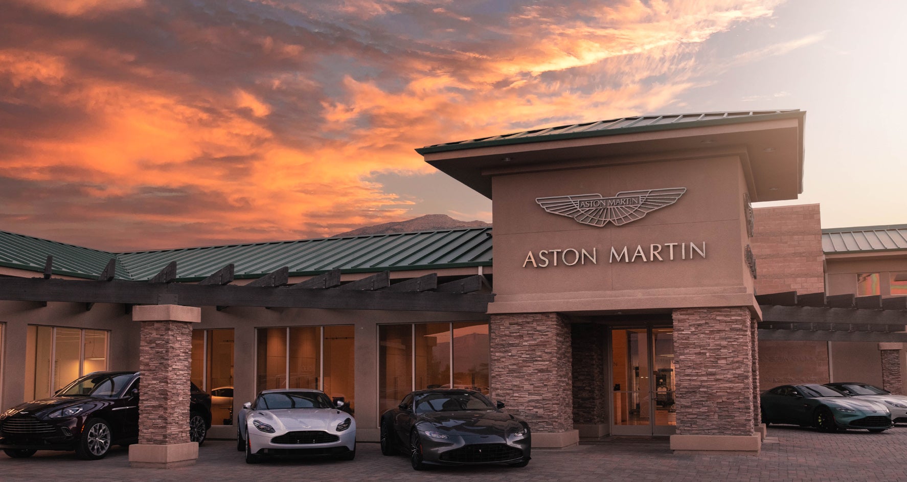 Aston Martin Rancho Mirage dealership exterior at sunset